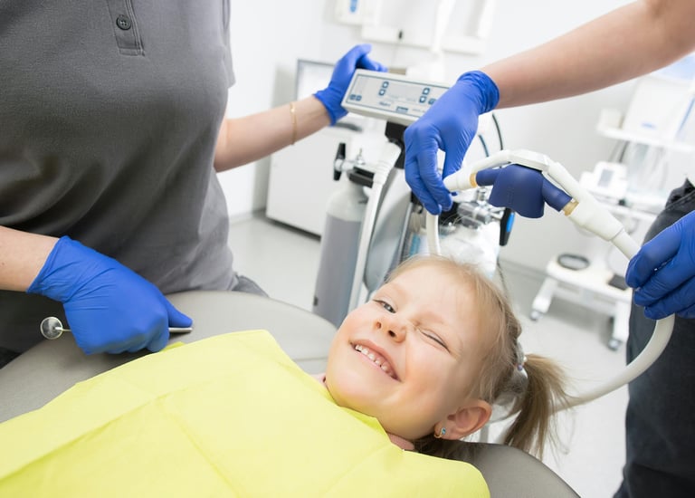 Child receiving gentle dental care